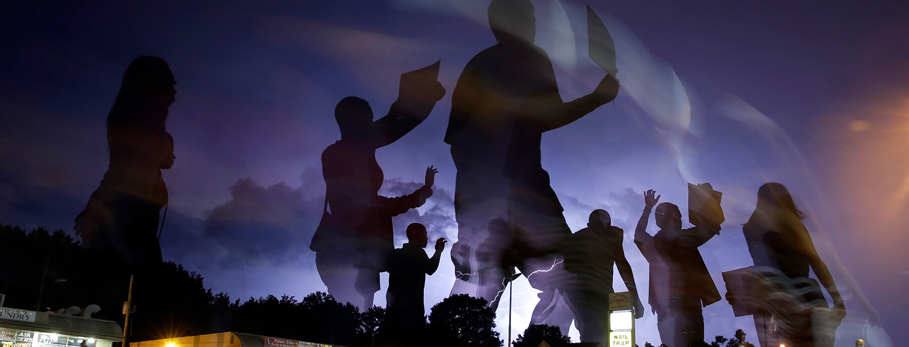 Protesters march in Ferguson, MO after Michael Brown was fatally shot